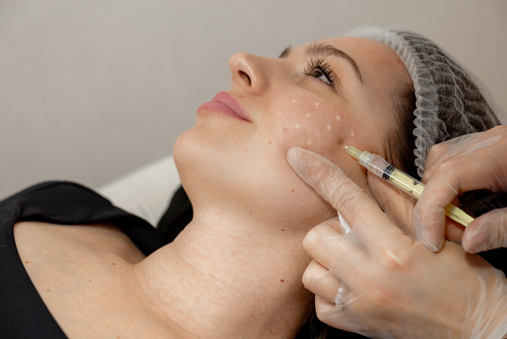 woman getting collagen stimulating injections with Sculptra in Bethesda